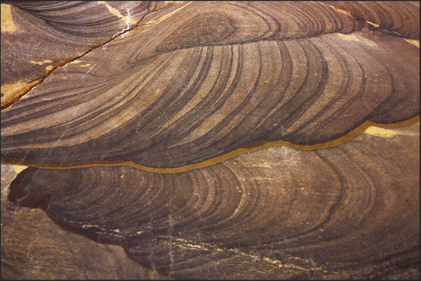 On the walls of the canyon, layers of oxides create fantastic designs On the walls of the canyon, layers of oxides create fantastic designs
