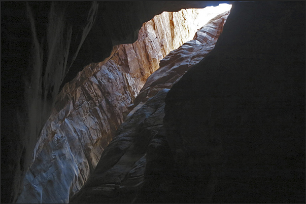The high walls of the canyon, rise vertically sometimes, obscuring even the sky The high walls of the canyon, rise vertically sometimes, obscuring even the sky