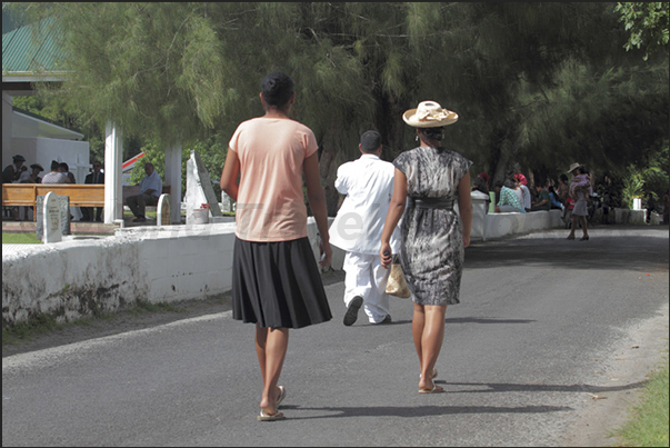 On Sunday, the population is in the gardens and along the roads leading to the various churches in town On Sunday, the population is in the gardens and along the roads leading to the various churches in town
