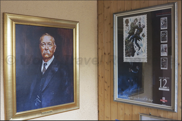 Sir Conan Doyle and, in the stamp on the right, the depiction of the death of S.Holmes in the waters of Reichenbach Falls Sir Conan Doyle and, in the stamp on the right, the depiction of the death of S.Holmes in the waters of Reichenbach Falls