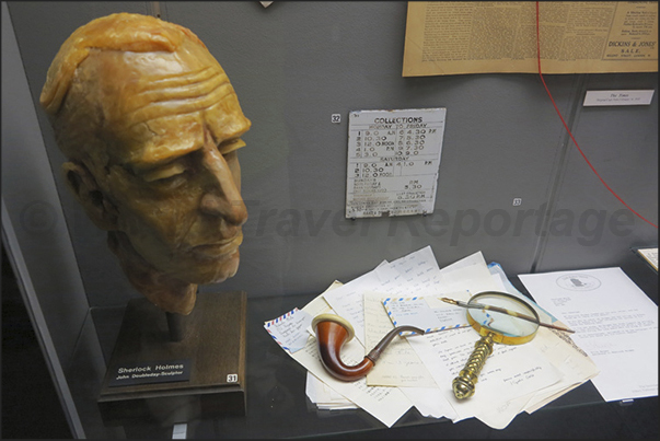 Sherlock Holmes and some of his characteristic objects as pipe and magnifying glass Sherlock Holmes and some of his characteristic objects as pipe and magnifying glass