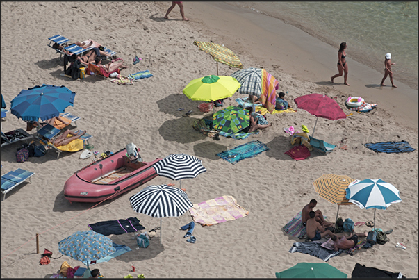 The beach of Masua. Once, site of an important mining town for the processing of minerals extracted from the mines of Porto Flavia The beach of Masua. Once, site of an important mining town for the processing of minerals extracted from the mines of Porto Flavia