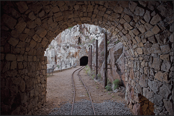 The rail route within the mine in the village of Buggerru. Mines which penetrate the rocky cliff overlooking the sea The rail route within the mine in the village of Buggerru. Mines which penetrate the rocky cliff overlooking the sea