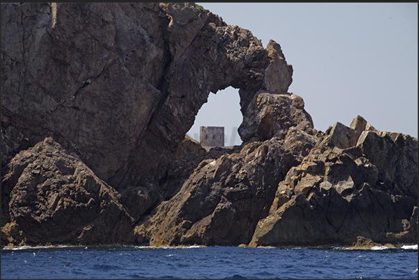 The ancient Spanish watchtower (eighteenth century) at the entrance to Cala Domestica Bay