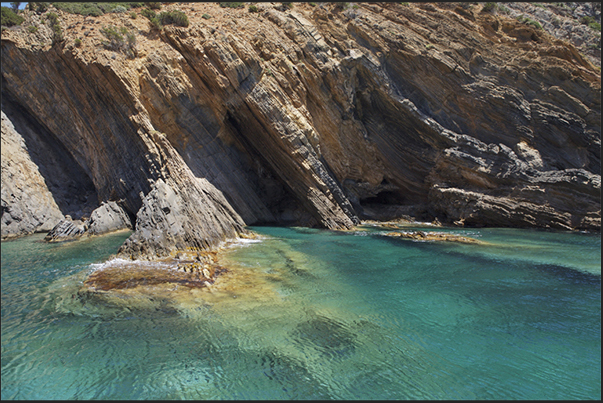 The cliff between Cala Domestica Bay and Porto Flavia. A paradise for anyone who rents a small boat for cruise along the coast