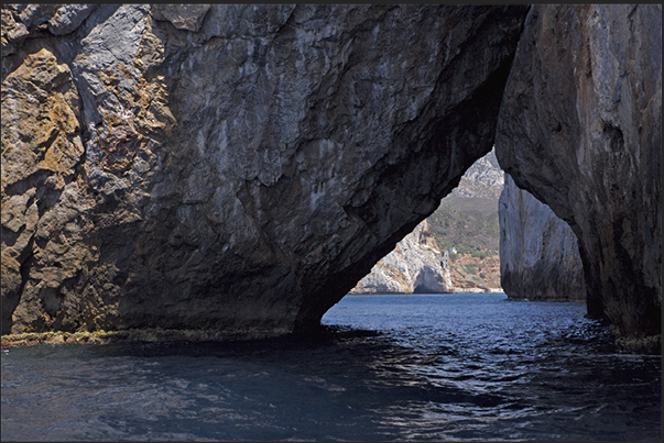 One of the two large cracks in the rock of the island called Pan di Zucchero (Sugarloaf), in the Masua bay, in front of Porto Flavia