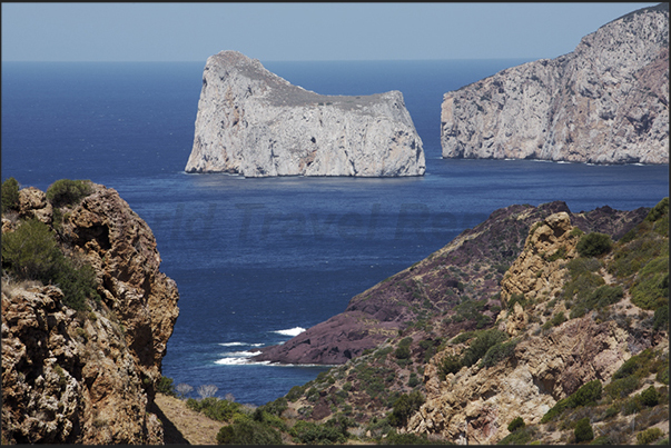 The cliffs below the village of Nebida between Masua Bay and Portoscuso. On the horizon (left), the Pan di Zucchero island The cliffs below the village of Nebida between Masua Bay and Portoscuso. On the horizon (left), the Pan di Zucchero island