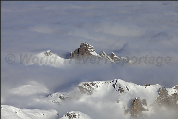 The Alps peak emerge out from the sea of clouds The Alps peak emerge out from the sea of clouds