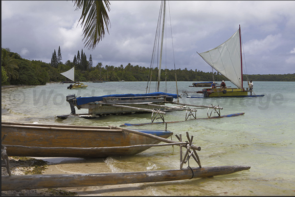 Fishing boats in the Bay of St Joseph which separates the main island from the small uninhabited island of Koutomo Fishing boats in the Bay of St Joseph which separates the main island from the small uninhabited island of Koutomo