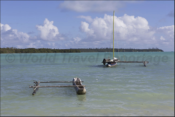 Fishing boats in the Bay of St Joseph which separates the main island from the small uninhabited island of Koutomo Fishing boats in the Bay of St Joseph which separates the main island from the small uninhabited island of Koutomo