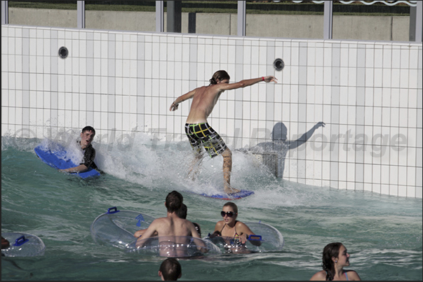 In larger pools, artificial waves are generated to be surfed In larger pools, artificial waves are generated to be surfed