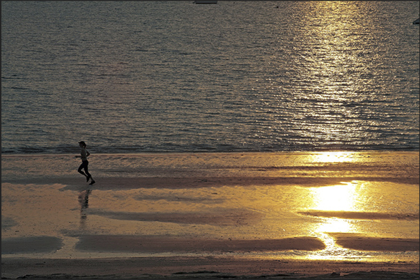 Darwin. Running on the beach in Fanni Bay Darwin. Running on the beach in Fanni Bay