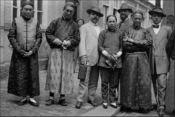 Tourists posing with a group of Chinese Tourists posing with a group of Chinese