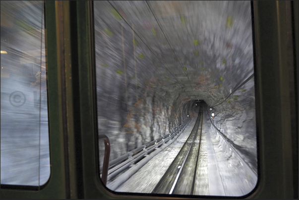The tunnel of 7.5 km, dug in the Eiger and Monch at the beginning of 1900, has two stops before reaching the Jungfrau Pass The tunnel of 7.5 km, dug in the Eiger and Monch at the beginning of 1900, has two stops before reaching the Jungfrau Pass