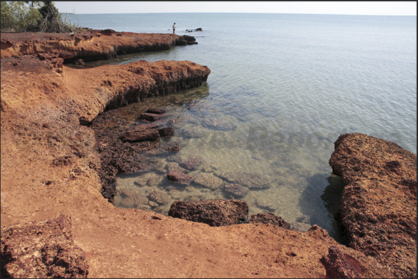 Garig Ganuk Barlu NP. At sunset, the cliffs take a strong red color due to the low angle of the sun on the horizon Garig Ganuk Barlu NP. At sunset, the cliffs take a strong red color due to the low angle of the sun on the horizon