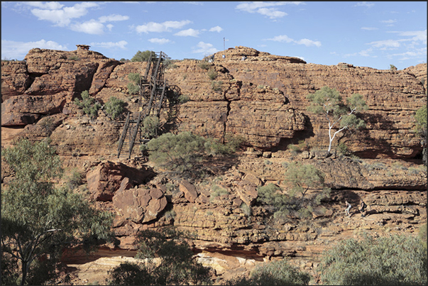 Watarrka National Park-Kings Canyon. Stairs to facilitate the descent into the secondary canyons Watarrka National Park-Kings Canyon. Stairs to facilitate the descent into the secondary canyons