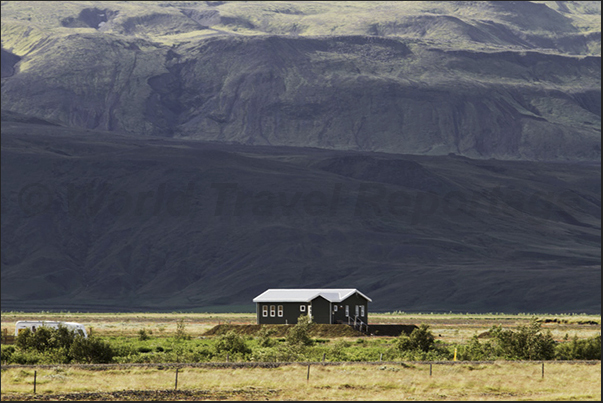 An isolated house at the base of Tindfjoll Glacier An isolated house at the base of Tindfjoll Glacier