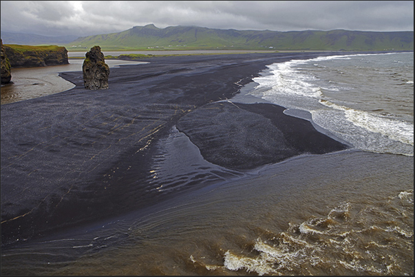The black lava beach on Dyrholaey Bay The black lava beach on Dyrholaey Bay