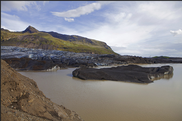 Highway 1. The raod, pass close to the Vatnajokull and Svinafellsjokull glacier and a tongue of ice ends in a lake
