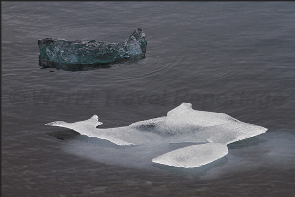 Iceberg on the lake formed by Jokulsarlon Glacier. Dolphin of ice Iceberg on the lake formed by Jokulsarlon Glacier. Dolphin of ice