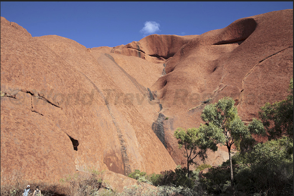 Uluru-Kata Tjuta National Park. The high vertical walls of Uluru Uluru-Kata Tjuta National Park. The high vertical walls of Uluru