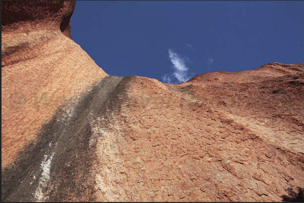 Uluru-Kata Tjuta National Park. The high vertical walls of Uluru