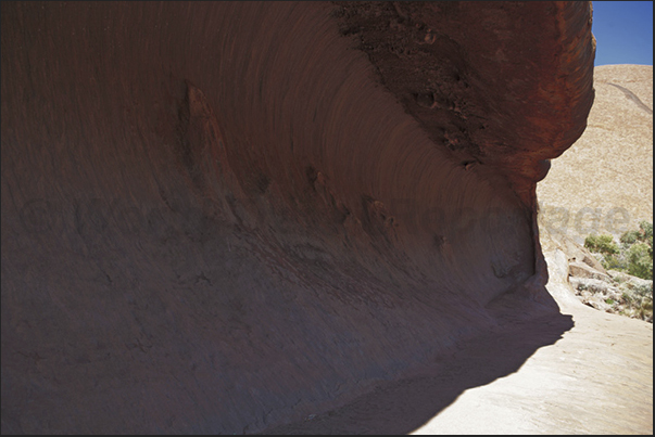 Uluru-Kata Tjuta N.P. A wave of stone at the base of the monolith of Uluru