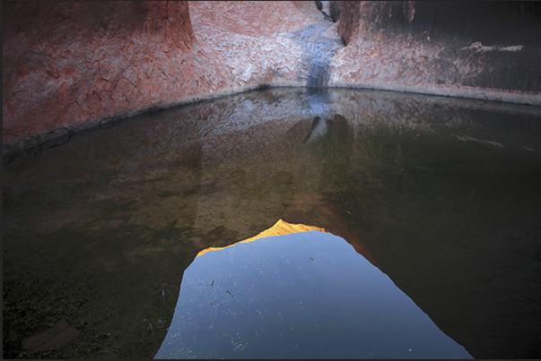 Uluru-Kata Tjuta National Park. Small lakes of rainwater at the base of Mount Uluru