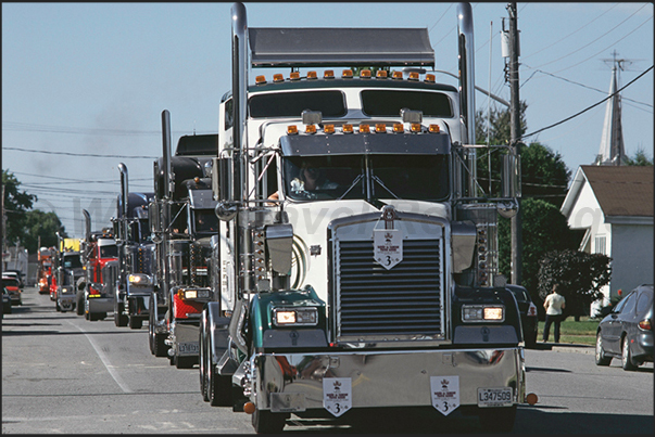 The parade of over 500 trucks through the streets of the country before starting the beauty contest and the race uphill The parade of over 500 trucks through the streets of the country before starting the beauty contest and the race uphill
