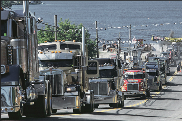 The parade of over 500 trucks through the streets of the country before starting the beauty contest and the race uphill The parade of over 500 trucks through the streets of the country before starting the beauty contest and the race uphill