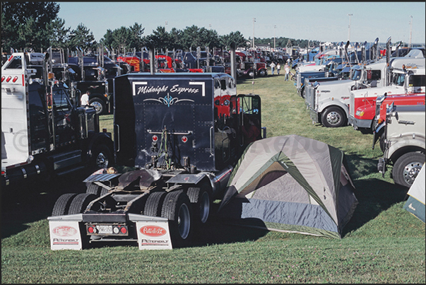 All 500 trucks are parked in the meadows around the town All 500 trucks are parked in the meadows around the town