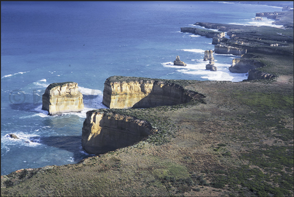 The coastline called 12 apostles. Today of the 12 limestone stacks remain only 8 limestone and the coast is always changing The coastline called 12 apostles. Today of the 12 limestone stacks remain only 8 limestone and the coast is always changing