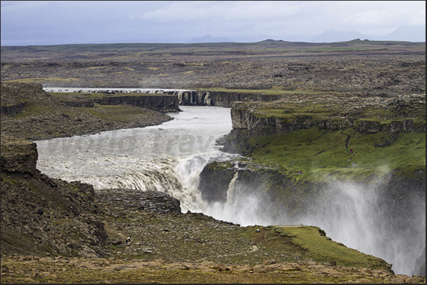 Dettifoss Selfoss Falls and the canyon generated by the waters of melting glaciers in the center of the island Dettifoss Selfoss Falls and the canyon generated by the waters of melting glaciers in the center of the island