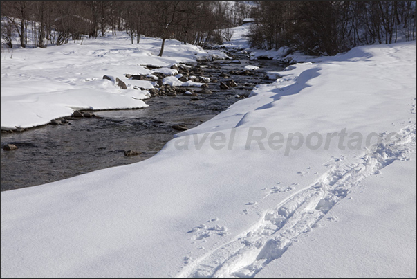 The river flows in the bottom of the valley that saw some races of the Winter Olympics Games in 1992