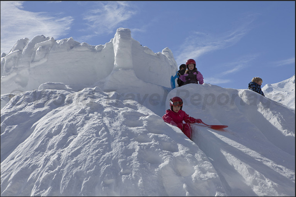 Not sand castles but snow castles for children waiting to go skiing Not sand castles but snow castles for children waiting to go skiing