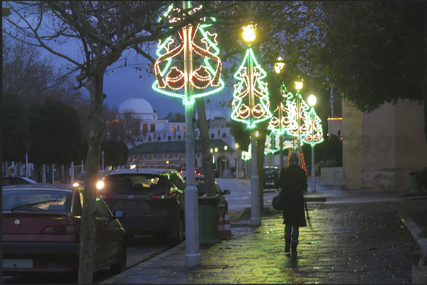 Rhodes town. The streets on the waterfront, shine under the Christmas lights just past Rhodes town. The streets on the waterfront, shine under the Christmas lights just past