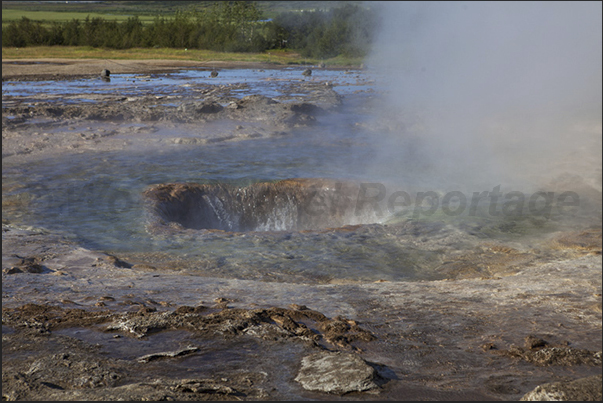 Selfoss, Park of Geyser. The geyser is filled again of water Selfoss, Park of Geyser. The geyser is filled again of water