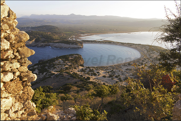 The entrance from the sea to Bay of Voidhokilia (left) and behind, the pond of Ghialova seen from the ruins of Navarino Castle The entrance from the sea to Bay of Voidhokilia (left) and behind, the pond of Ghialova seen from the ruins of Navarino Castle