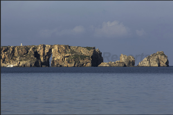 The cliff of the island of Sfaktiria in front of the town of Pylos The cliff of the island of Sfaktiria in front of the town of Pylos