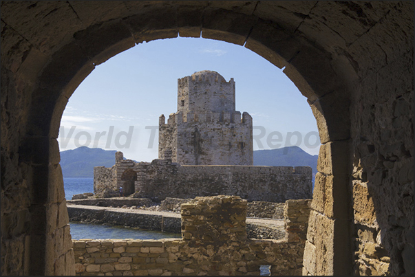 Ancient fortress of Methoni. The watchtower at the entrance of the port Ancient fortress of Methoni. The watchtower at the entrance of the port