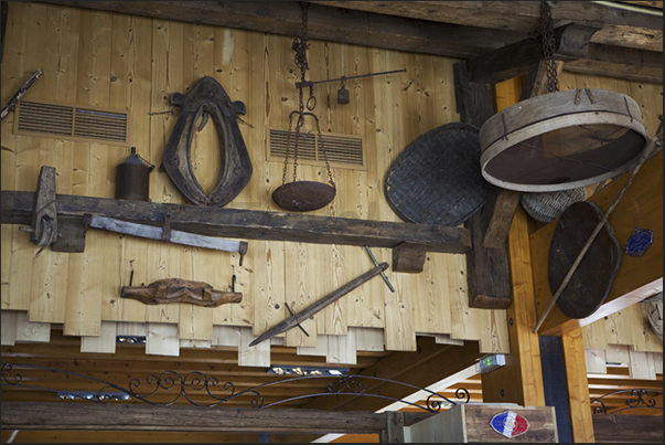 Farm tools hanging from a hut