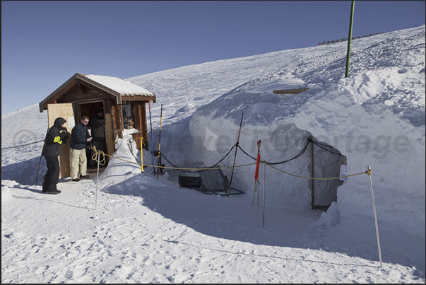 Entrance to the cave dug in Mantel glacier at 3200 m