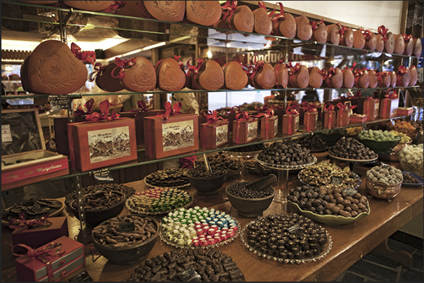 Biscuits, cakes and a chocolate fountain in one of the shop most visited by tourists Biscuits, cakes and a chocolate fountain in one of the shop most visited by tourists