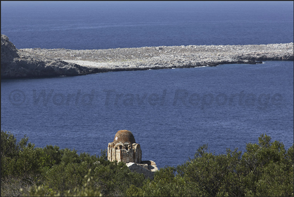 The rocky peninsula of Cape Tighani with the ruins of an old Venetian fortress The rocky peninsula of Cape Tighani with the ruins of an old Venetian fortress