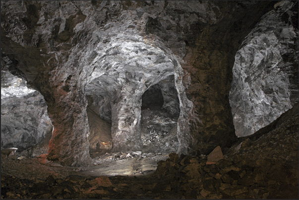 Gypsum mine. Three columns tens meters high, supporting the rocky ceiling Gypsum mine. Three columns tens meters high, supporting the rocky ceiling