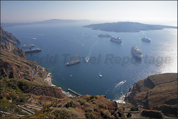 Cruise ships anchored in the ancient cone of the volcano