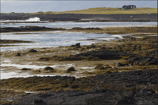 The rugged southwest coast near the lighthouse of Litlagata The rugged southwest coast near the lighthouse of Litlagata