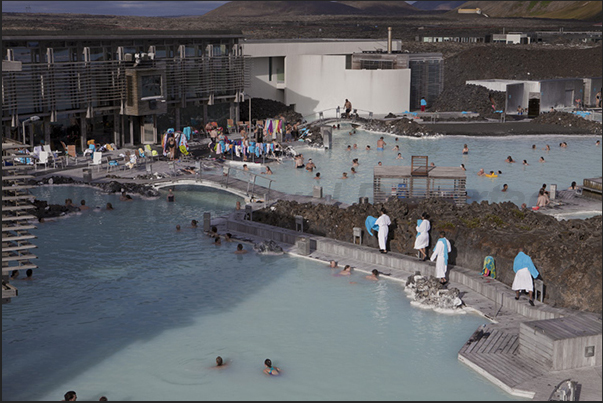 Blue Lagoon. The large public swimming pool with warm waters and white sludge used as a beneficial treatment for the skin Blue Lagoon. The large public swimming pool with warm waters and white sludge used as a beneficial treatment for the skin