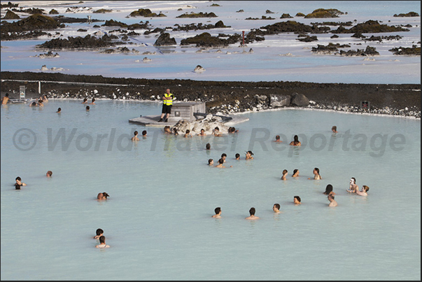 Blue Lagoon. The large public swimming pool with warm waters and white sludge used as a beneficial treatment for the skin Blue Lagoon. The large public swimming pool with warm waters and white sludge used as a beneficial treatment for the skin