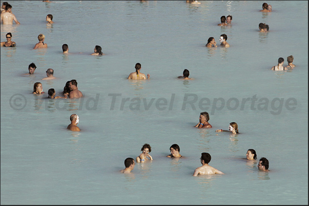 Blue Lagoon. The large public swimming pool with warm waters and white sludge used as a beneficial treatment for the skin Blue Lagoon. The large public swimming pool with warm waters and white sludge used as a beneficial treatment for the skin